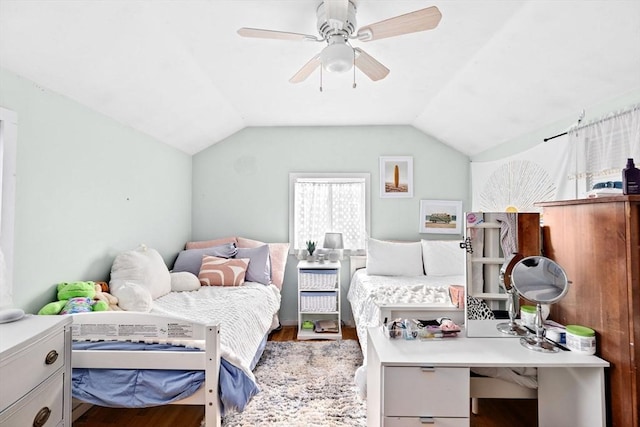 bedroom featuring vaulted ceiling and wood finished floors