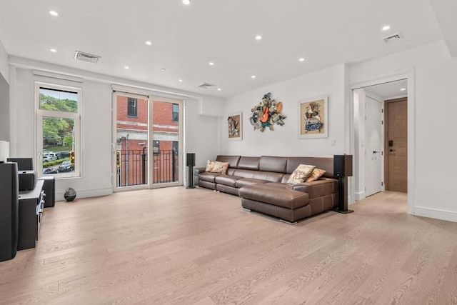69 Walnut St Unit 4, Brookline, MA 02445 - living area featuring light wood finished floors, recessed lighting, and baseboards