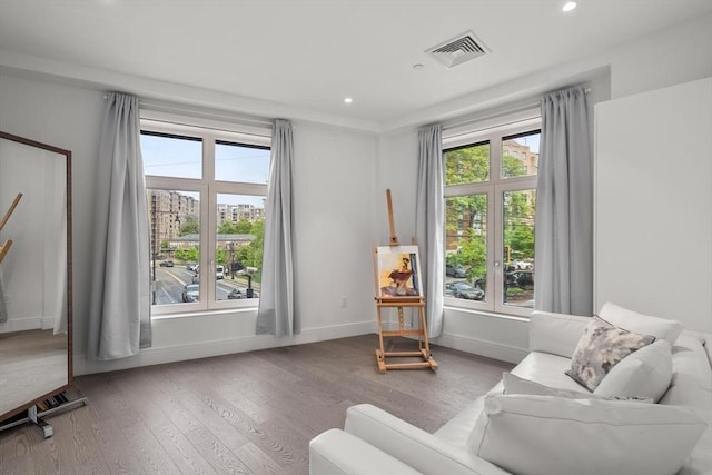 69 Walnut St Unit 4, Brookline, MA 02445 - sitting room with wood finished floors, recessed lighting, and baseboards