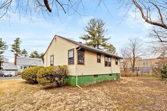 view of property exterior with fence