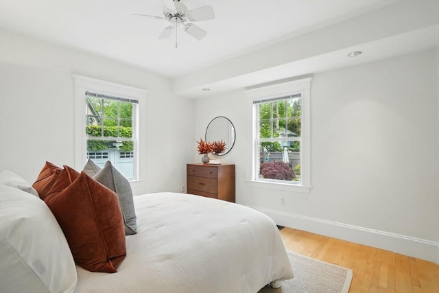 11 Longfellow Rd, Cambridge, MA 02138 - bedroom with multiple windows, wood finished floors, baseboards, a ceiling fan, and recessed lighting