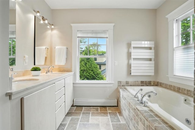 11 Longfellow Rd, Cambridge, MA 02138 - bathroom with baseboard heating, plenty of natural light, double vanity, and a whirlpool tub