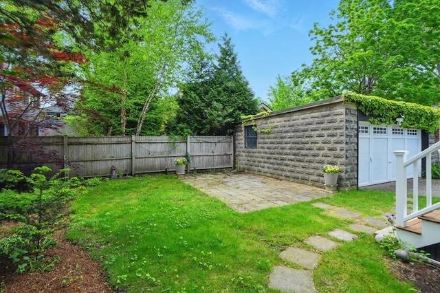 11 Longfellow Rd, Cambridge, MA 02138 - view of yard with a patio, an outdoor structure, and a garage