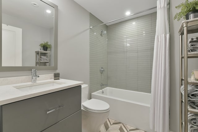 full bathroom featuring shower / bath combo, vanity, and toilet