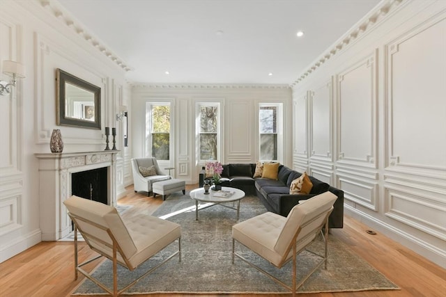 65 Marlborough St Unit 1-6, Boston, MA 02116 - living room featuring a decorative wall, light wood-style floors, a fireplace, ornamental molding, and recessed lighting