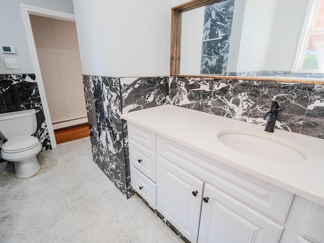 461 Aiken Ave, Dracut, MA 01826 - bathroom with a baseboard radiator, vanity, tile walls, and a wainscoted wall