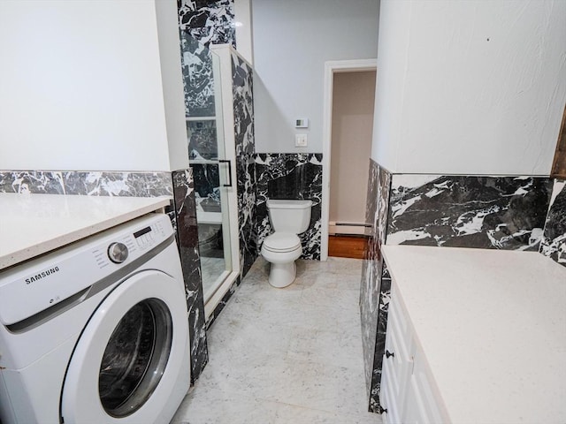 461 Aiken Ave, Dracut, MA 01826 - bathroom featuring washer / dryer, baseboard heating, tile walls, and a wainscoted wall