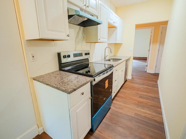 461 Aiken Ave, Dracut, MA 01826 - kitchen featuring stainless steel range with electric stovetop, under cabinet range hood, light wood-style floors, and white cabinetry