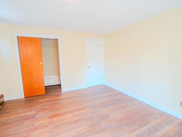 461 Aiken Ave, Dracut, MA 01826 - unfurnished bedroom featuring wood finished floors