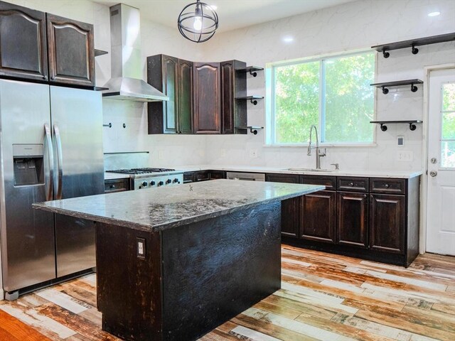 461 Aiken Ave, Dracut, MA 01826 - kitchen featuring appliances with stainless steel finishes, wall chimney range hood, open shelves, and light wood-type flooring