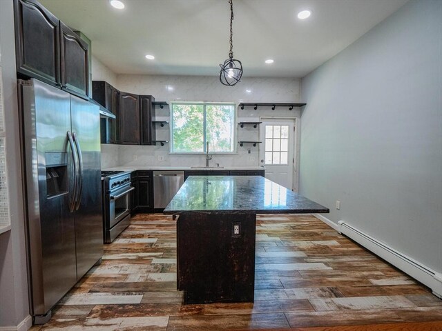 461 Aiken Ave, Dracut, MA 01826 - kitchen with stainless steel appliances, open shelves, a baseboard radiator, a center island, and recessed lighting