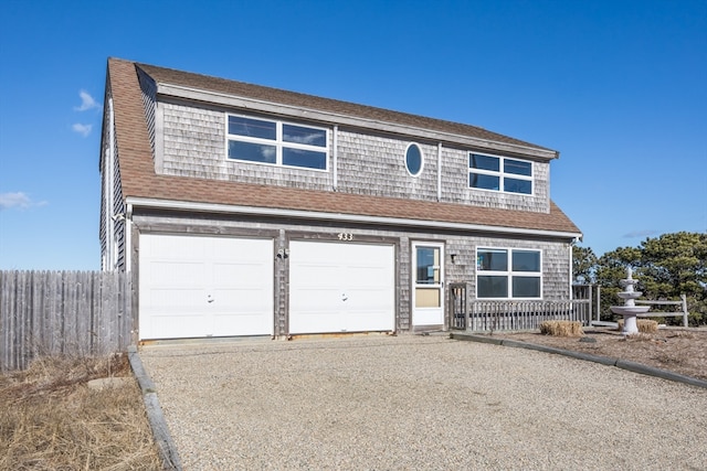 view of front of property with a garage