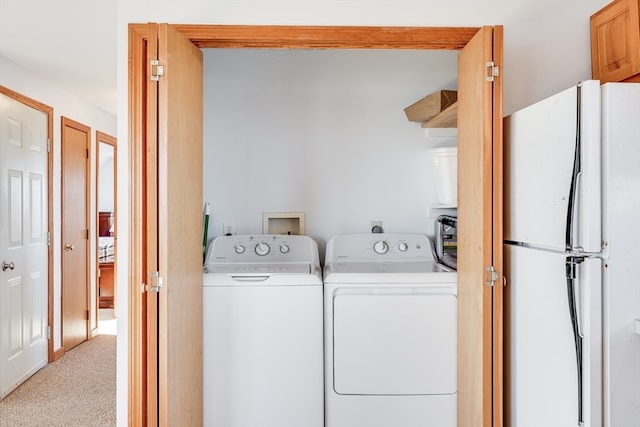 433 Shore Rd, Truro, MA 02652 - clothes washing area with light colored carpet, separate washer and dryer, and hookup for a washing machine