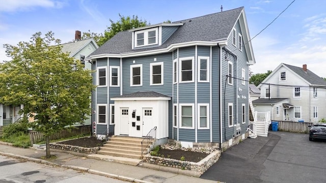 167 Charles St, Waltham, MA 02453 - view of front of property with a shingled roof and entry steps