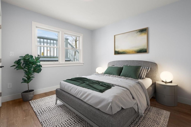 167 Charles St, Waltham, MA 02453 - bedroom featuring wood finished floors and baseboards