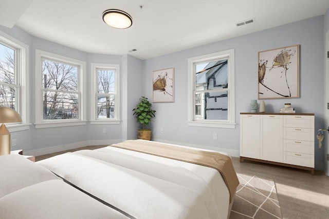167 Charles St, Waltham, MA 02453 - bedroom featuring baseboards and wood finished floors