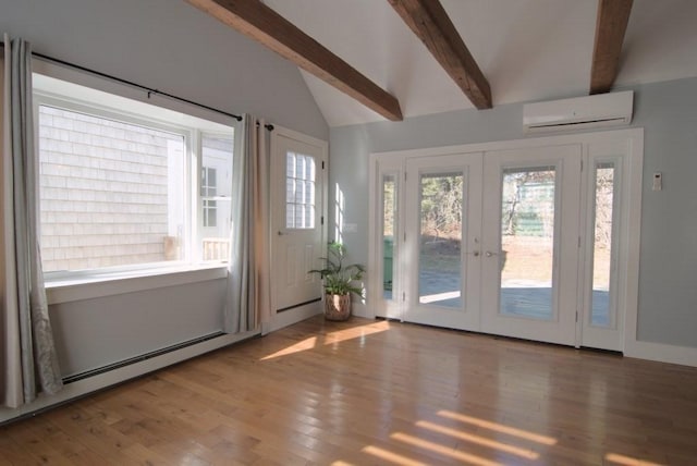 doorway to outside with french doors, a wall unit AC, lofted ceiling with beams, baseboard heating, and wood finished floors