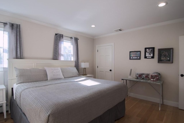 bedroom featuring baseboards, visible vents, ornamental molding, wood finished floors, and recessed lighting