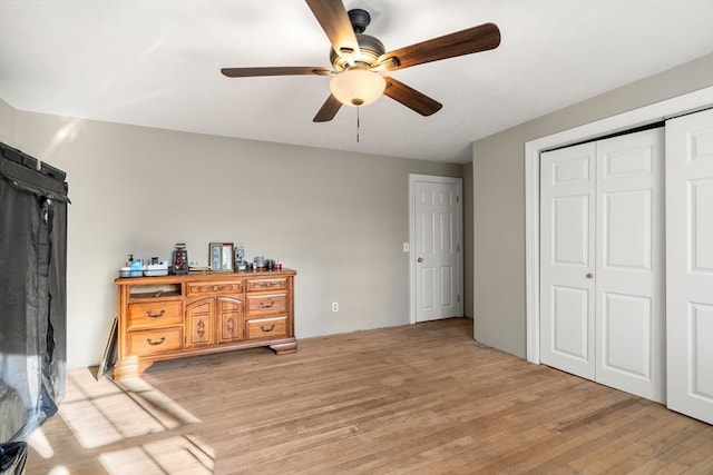 bedroom with ceiling fan and light wood-type flooring