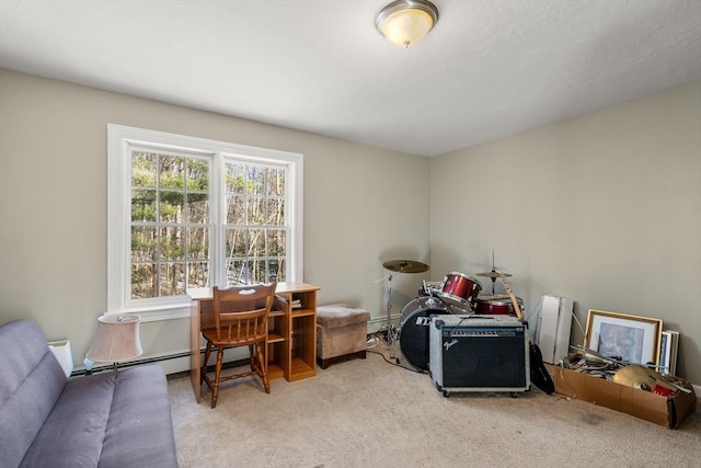 carpeted office space featuring a baseboard heating unit