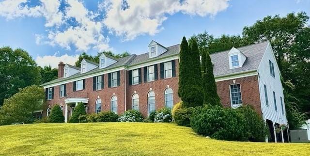 6 Everett Cir, Hopkinton, MA 01748 - view of front of house with a front yard and brick siding