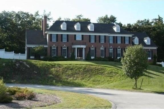 6 Everett Cir, Hopkinton, MA 01748 - georgian-style home featuring a front yard and fence