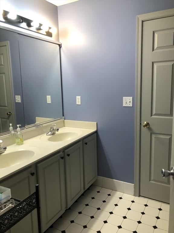 6 Everett Cir, Hopkinton, MA 01748 - bathroom featuring a sink, baseboards, and double vanity