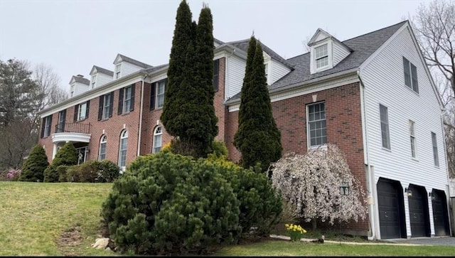 6 Everett Cir, Hopkinton, MA 01748 - view of home's exterior with brick siding, an attached garage, and a lawn
