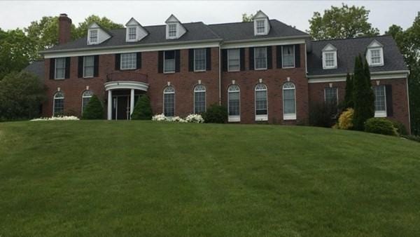 6 Everett Cir, Hopkinton, MA 01748 - colonial-style house with a front yard and brick siding