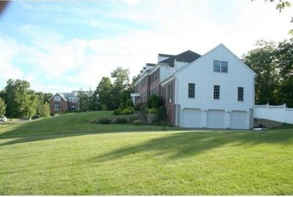 6 Everett Cir, Hopkinton, MA 01748 - view of property exterior with a yard and an attached garage
