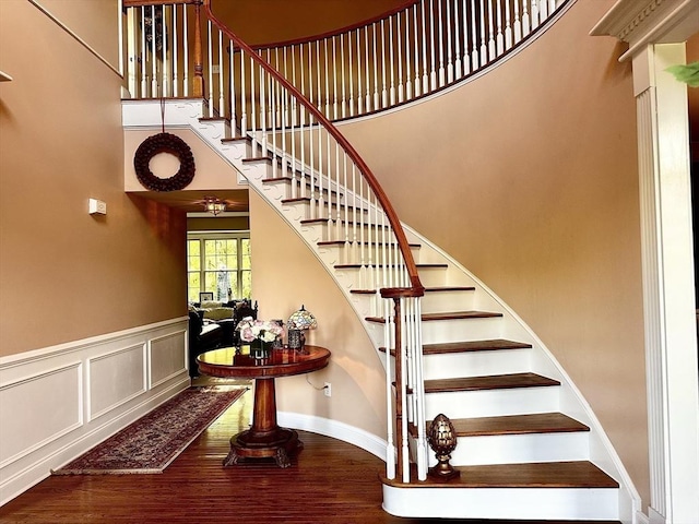 6 Everett Cir, Hopkinton, MA 01748 - stairs featuring wainscoting, a towering ceiling, and wood finished floors