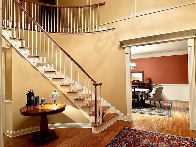 6 Everett Cir, Hopkinton, MA 01748 - stairs featuring wood-type flooring, baseboards, and crown molding