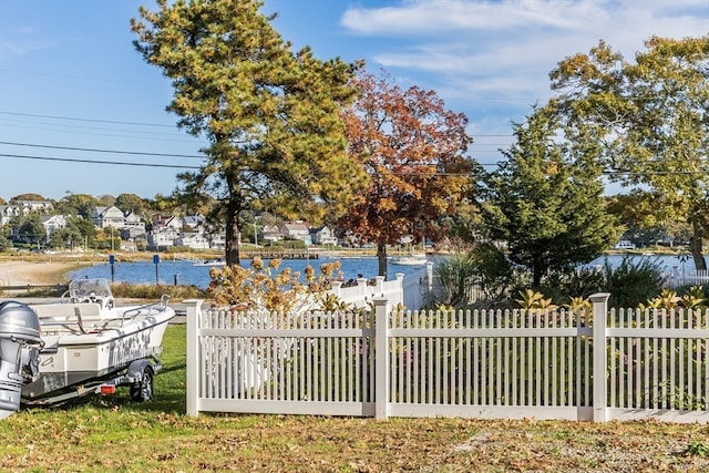 view of gate with a water view