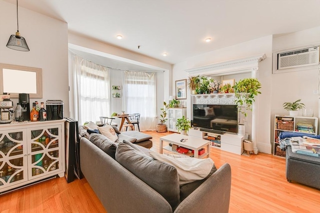 492 Massachusetts Ave Unit 53, Boston, MA 02118 - living room featuring a wall mounted air conditioner, wood finished floors, and recessed lighting