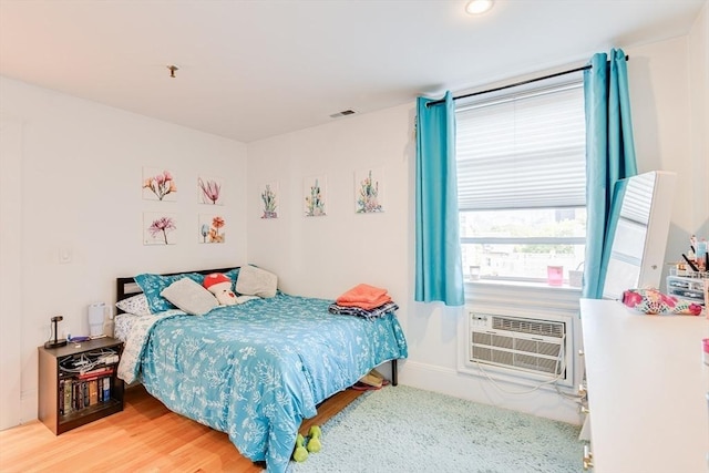 492 Massachusetts Ave Unit 53, Boston, MA 02118 - bedroom with wood finished floors and a wall mounted AC