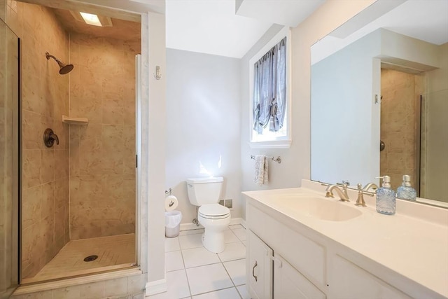 full bathroom with vanity, tile patterned floors, toilet, and a stall shower