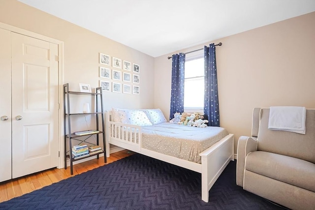 bedroom with wood finished floors