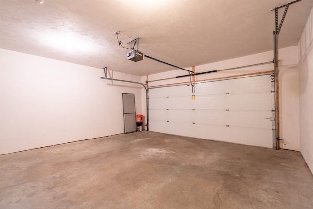 43 Blossom Sq Unit 43, Holden, MA 01520 - garage featuring a garage door opener