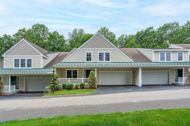 43 Blossom Sq Unit 43, Holden, MA 01520 - view of front of home with a standing seam roof, a metal roof, a porch, a garage, and driveway