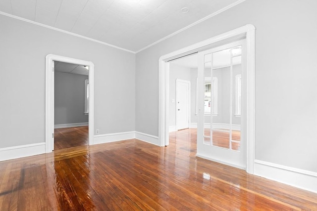 570 William St, Fall River, MA 02721 - spare room featuring ornamental molding, wood-type flooring, and baseboards