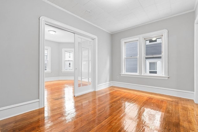 570 William St, Fall River, MA 02721 - empty room featuring ornamental molding, hardwood / wood-style flooring, and baseboards