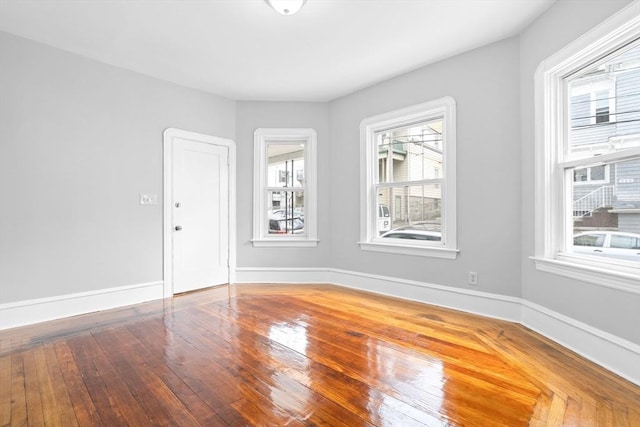 570 William St, Fall River, MA 02721 - empty room featuring hardwood / wood-style floors and baseboards