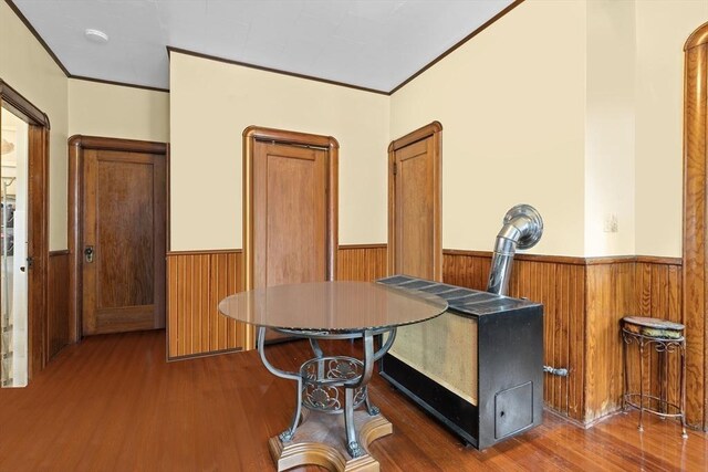 570 William St, Fall River, MA 02721 - dining space featuring wainscoting, wood finished floors, wooden walls, and ornamental molding