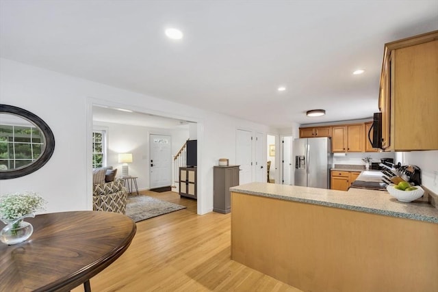 13 Pickerel Way, Sandwich, MA 02644 - kitchen with stainless steel fridge with ice dispenser, light wood finished floors, a peninsula, brown cabinets, and range