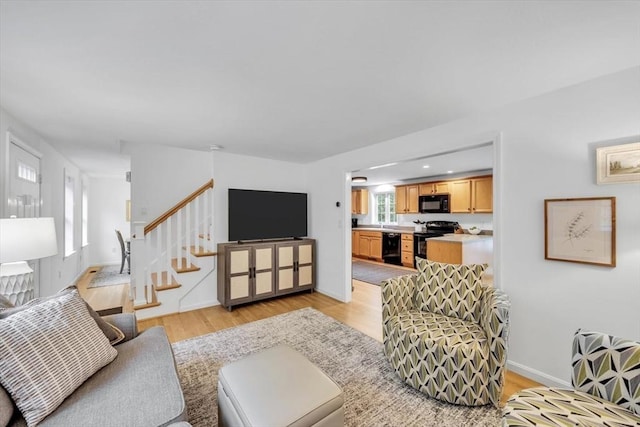 13 Pickerel Way, Sandwich, MA 02644 - living area with light wood-style flooring, stairway, and baseboards