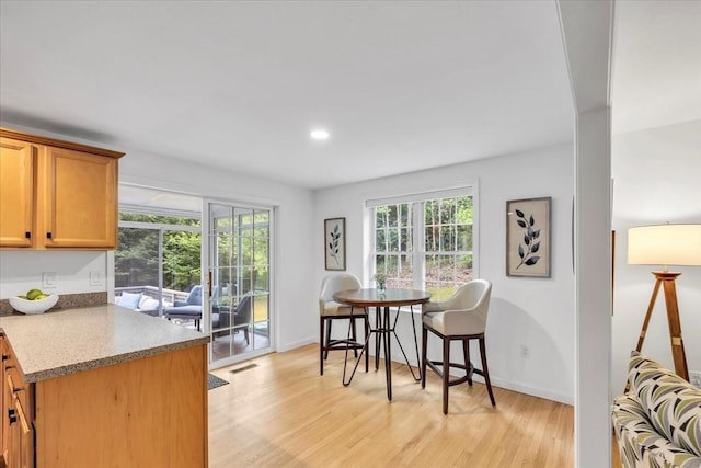 13 Pickerel Way, Sandwich, MA 02644 - kitchen featuring light wood-style floors, baseboards, recessed lighting, and brown cabinetry