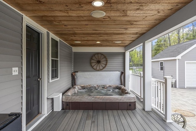 deck with a covered hot tub