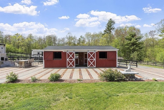 view of outbuilding featuring an exterior structure and an outdoor structure