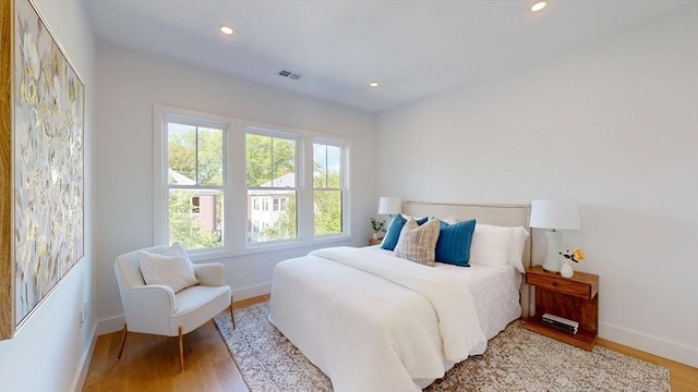 140 Columbia St Unit 2, Brookline, MA 02446 - bedroom with baseboards, wood finished floors, and recessed lighting