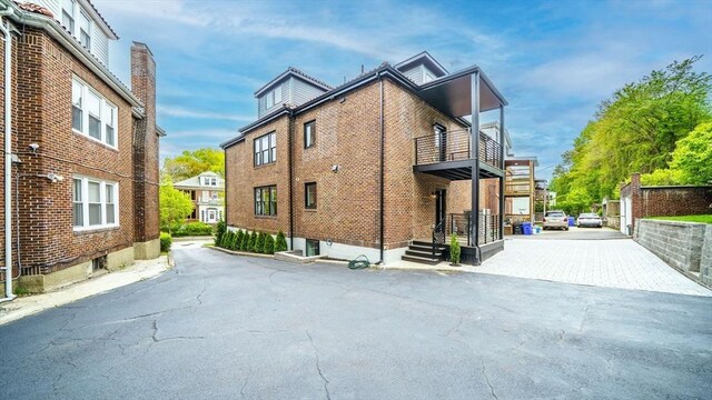 140 Columbia St Unit 2, Brookline, MA 02446 - view of home's exterior with a balcony